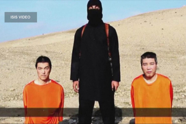 A still from an ISIS video showing Kenji Goto and Haruna Yakawa.