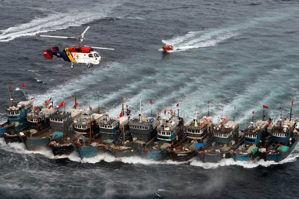 Chinese fishing boats being pursued by the South Korean Coast Guard. (Dong-A Ilbo/Getty Images)