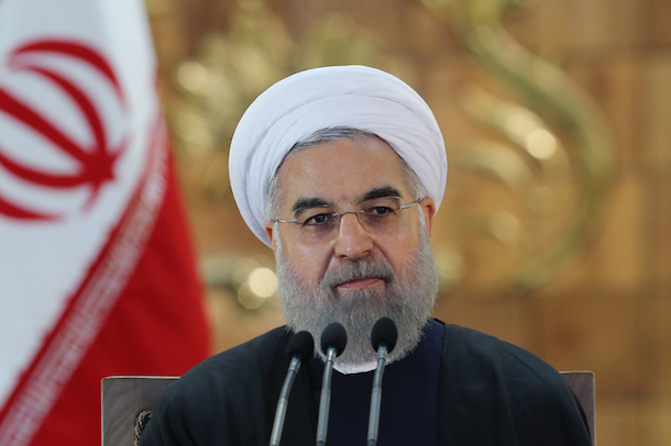 Iran's President Hassan Rouhani announcing an end to sanctions during a press conference. (FARS)