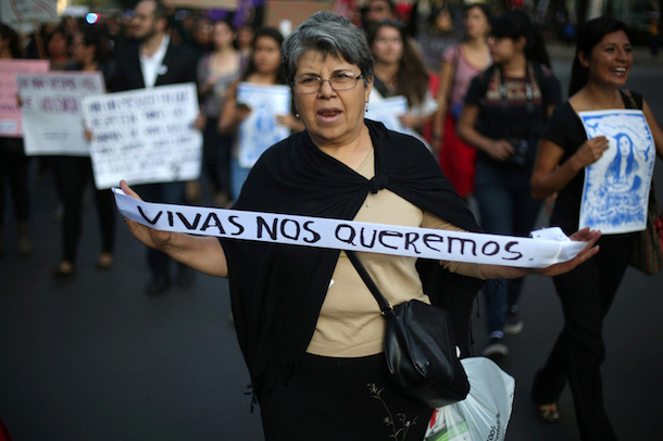 A Mexican protester against feminicide holds a sign: 'We want us alive.' (Edgard Garrido/Reuters)
