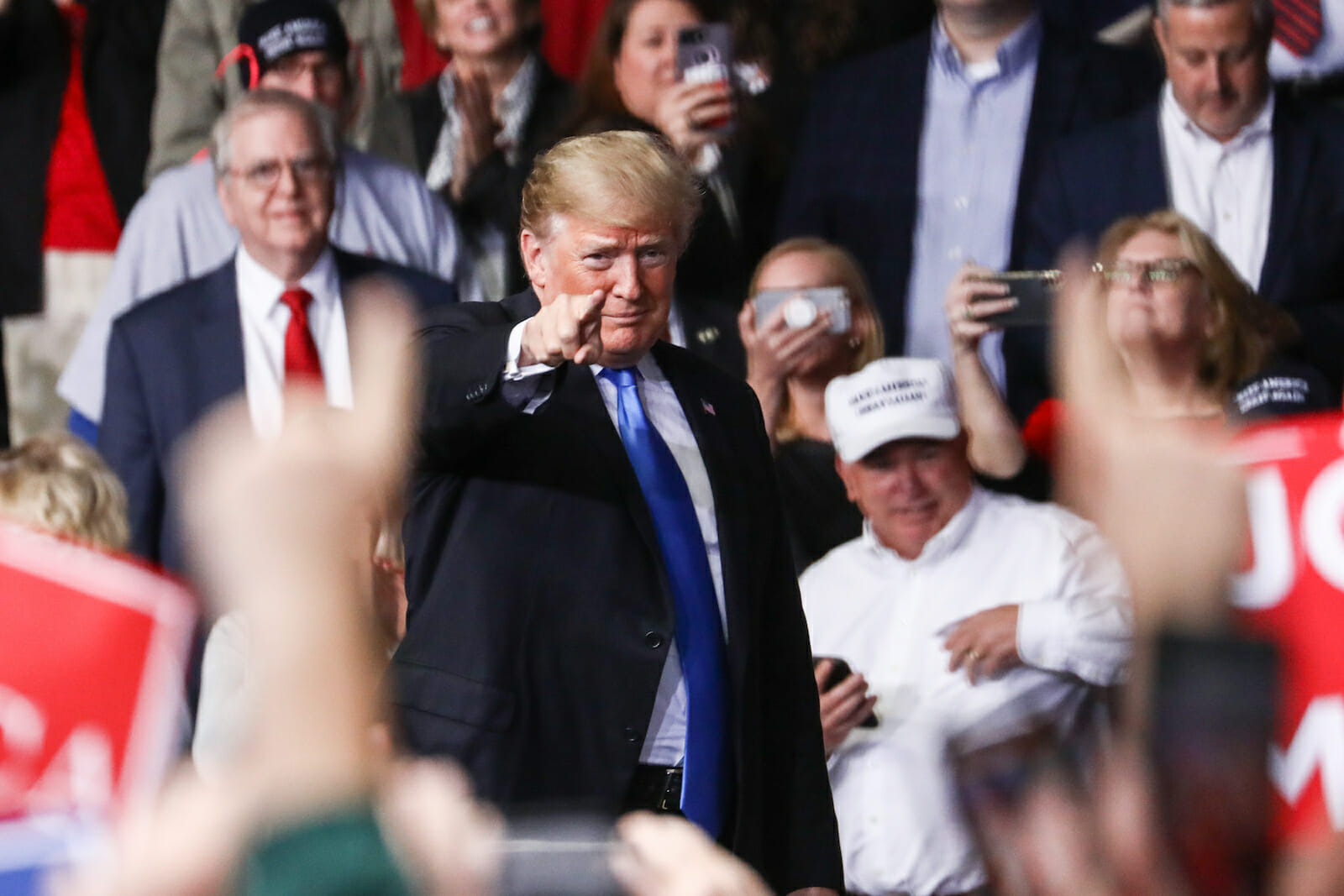Donald Trump pointing to his supporters during a rally