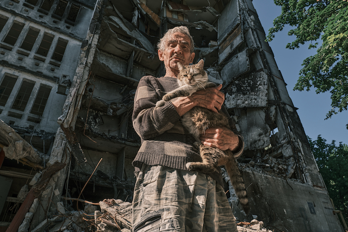A Ukrainian man holds his cat