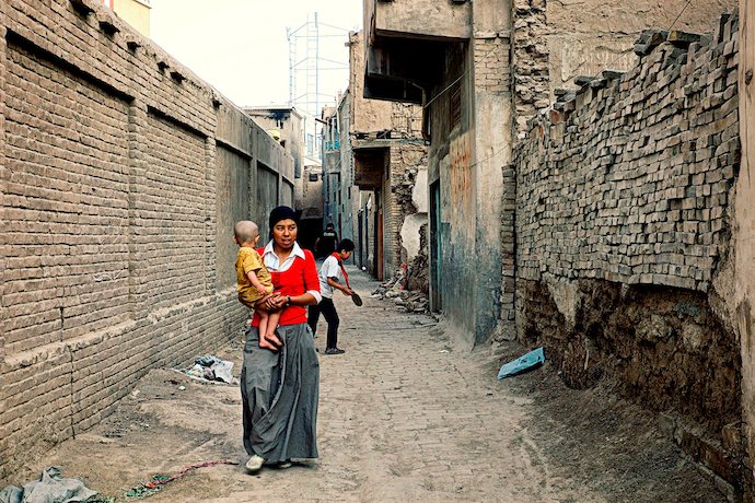 A young Uyghur woman and her child in Kashgar, China