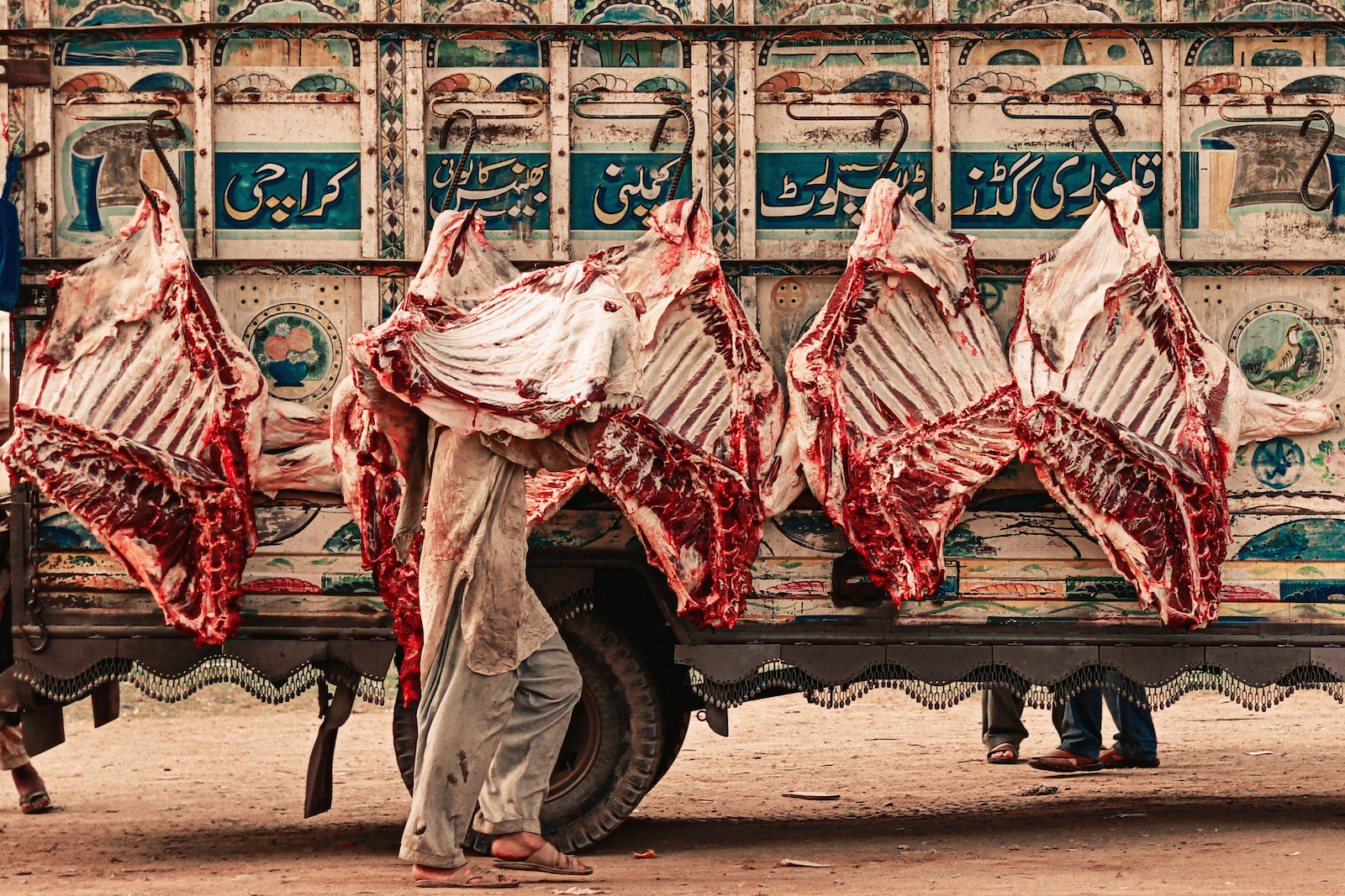 A man taking beef to the market in Karachi