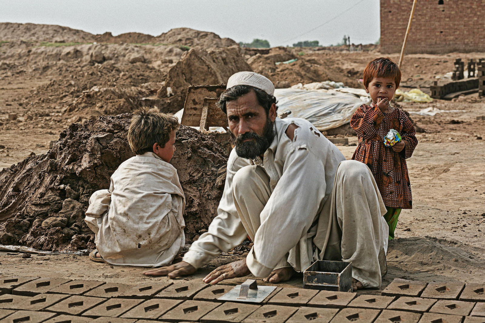 An Afghan refugee with his children in Peshawar, Pakistan