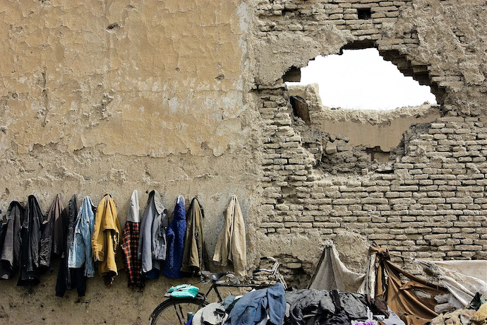 Afghan girls' coats hang outside a school in Kabul in 2006