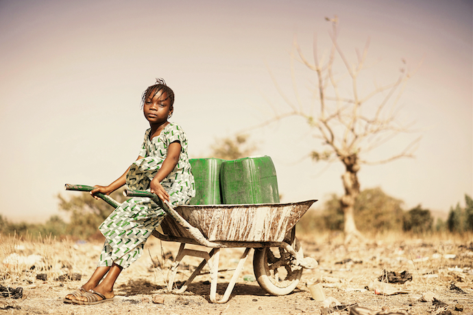 African girl collecting water
