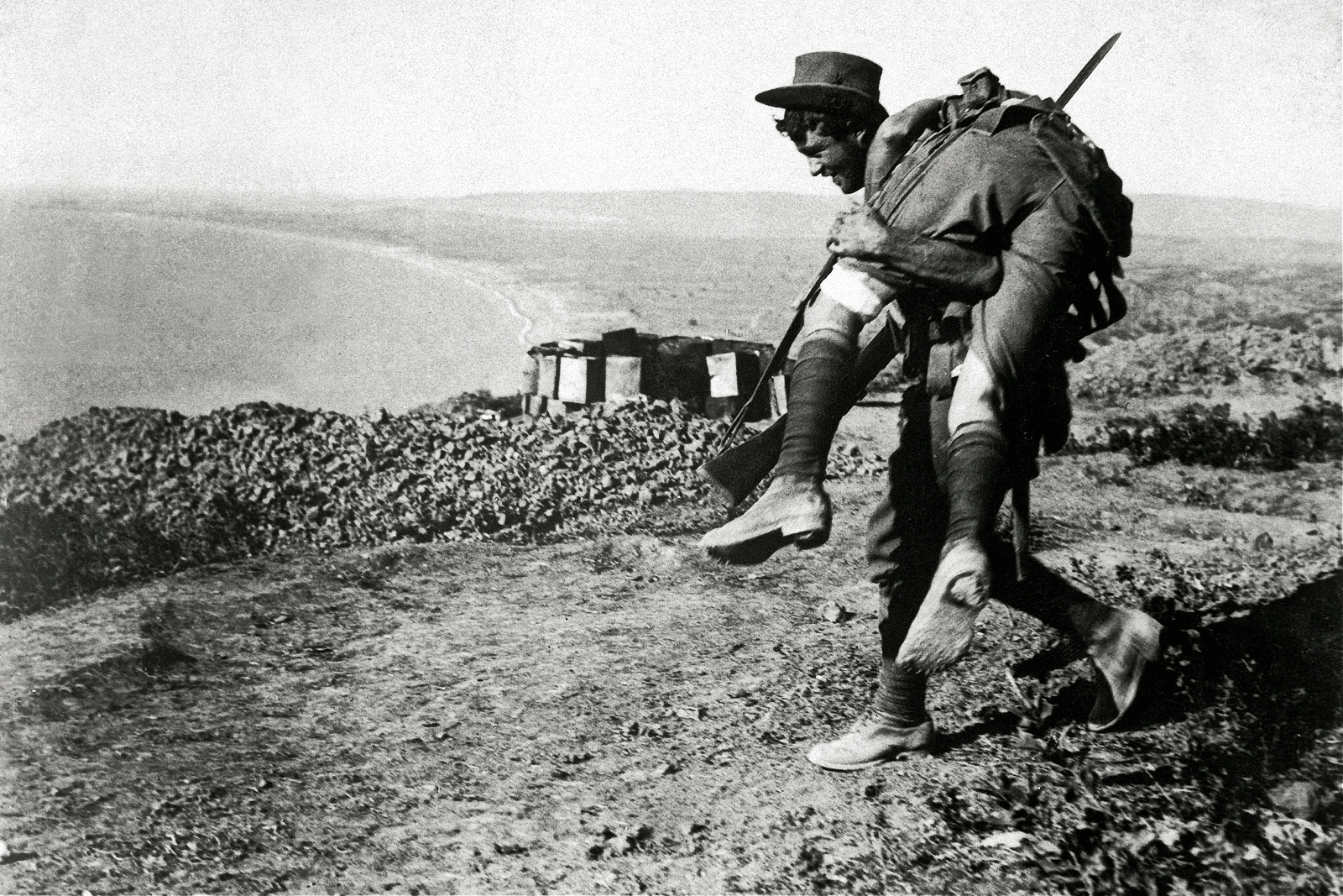 An Australian soldier carrying a wounded comrade during the Dardanelles Campaign in 1915