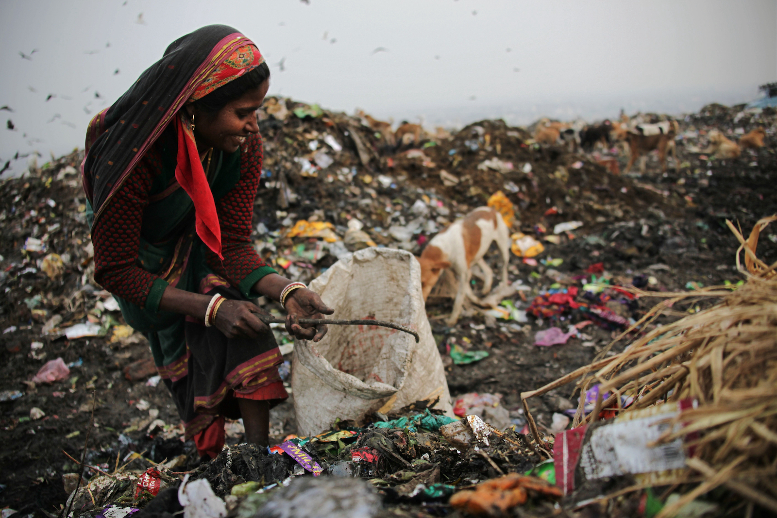Ragpickers at work in Ghazipur landfill, dubbed New Delhi's 'trash mountain.'