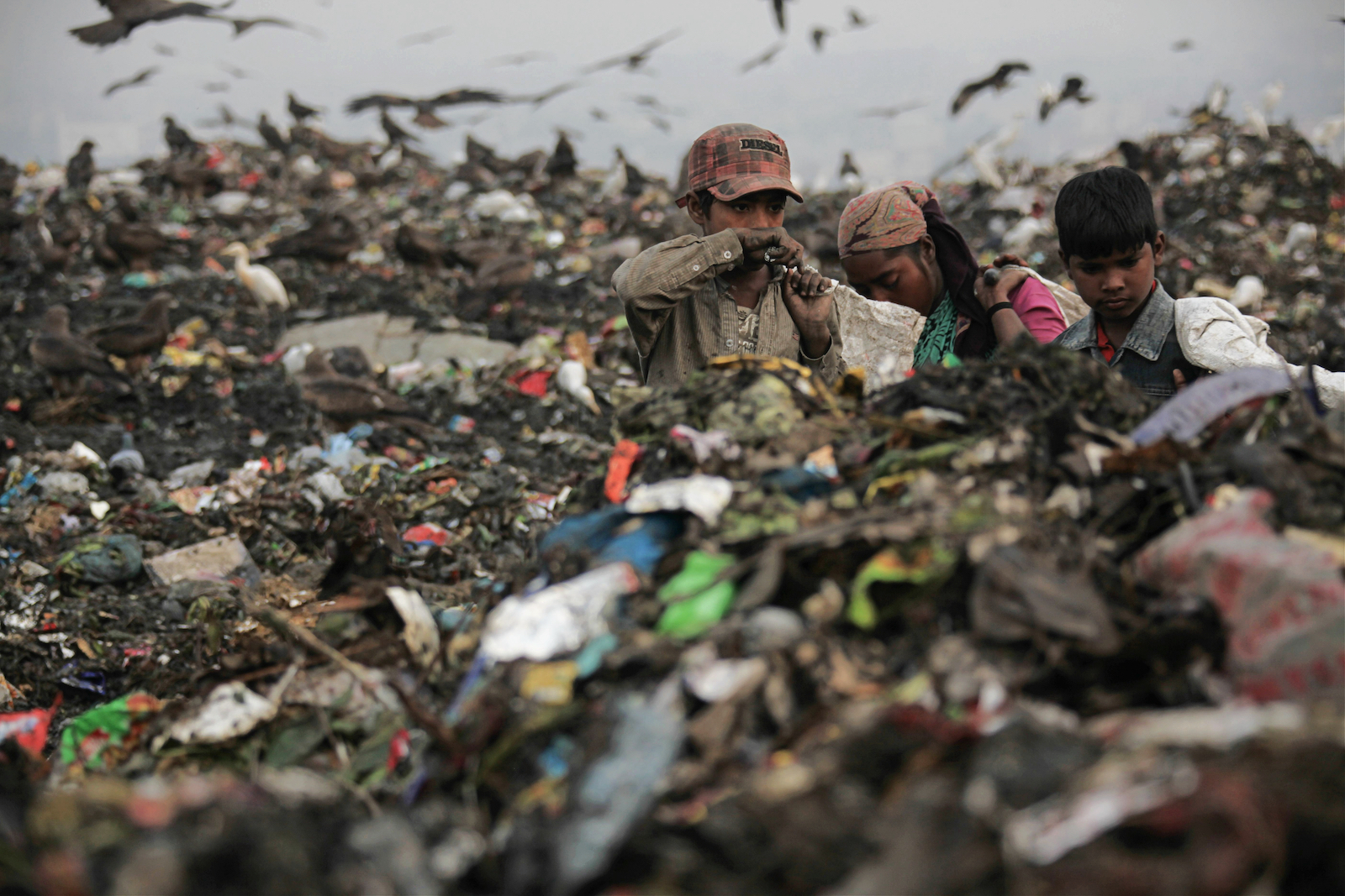 Ragpickers at work in Ghazipur landfill, dubbed New Delhi's 'trash mountain'