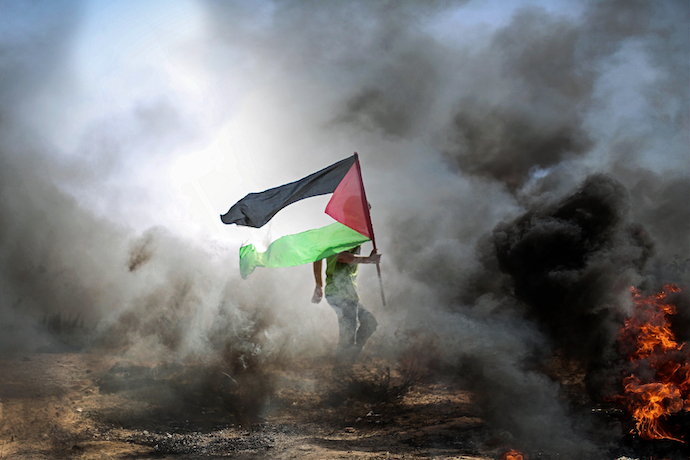 Palestinians protesting the Israeli occupation