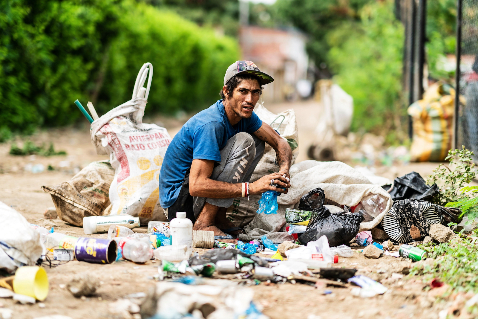 Homeless Venezuelan sorting through trash in Colombia