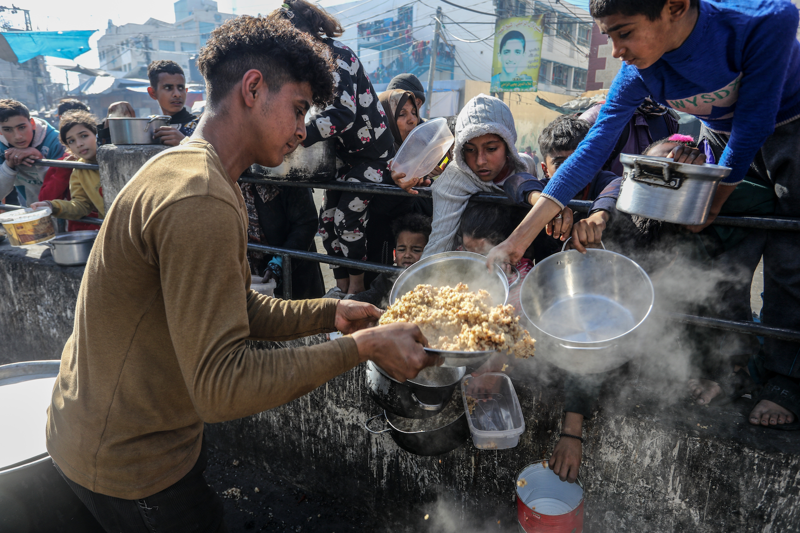 Food aid being distributed to displaced Palestinians in the Gaza Strip