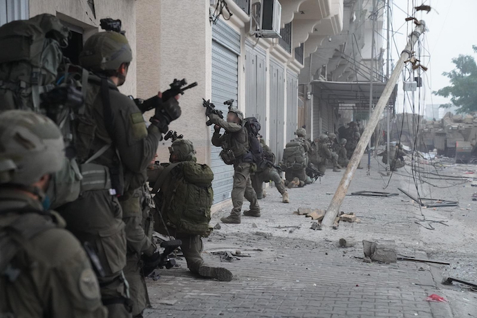 A photo released by the Israel Defense Forces shows Israeli soldiers engaged in combat in Gaza