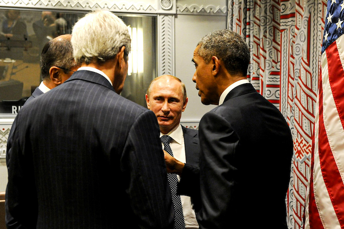 Vladimir Putin talking with former President Obama and John Kerry, Obama's chief diplomat at the time