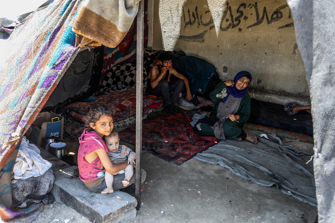 Displaced Palestinian family living on the street in central Gaza