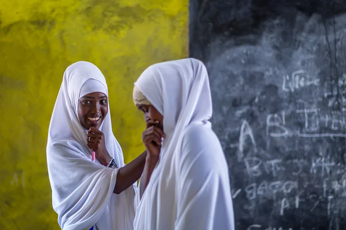 Two Somali refugee students in a refugee camp