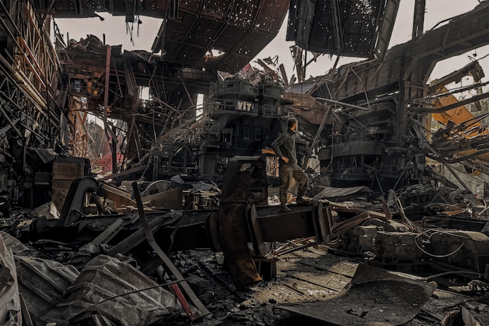 A Ukrainian soldier stands in the ruins of the Azovstal metalworks in Mariupol, Ukraine