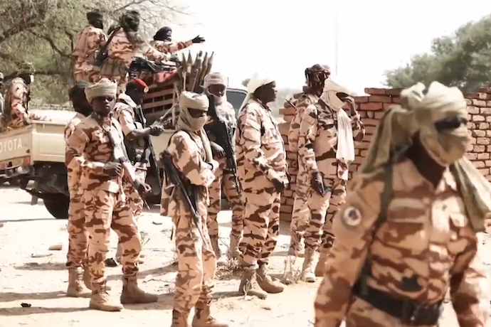 Chadian soldiers at the Chad-Sudan border monitoring refugees fleeing the civil war in Sudan