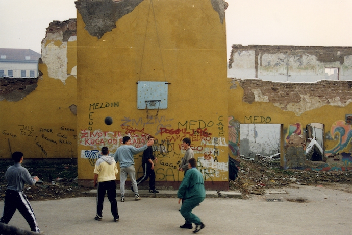 Kids playing basketball in the ruins of Sarajevo in 1997